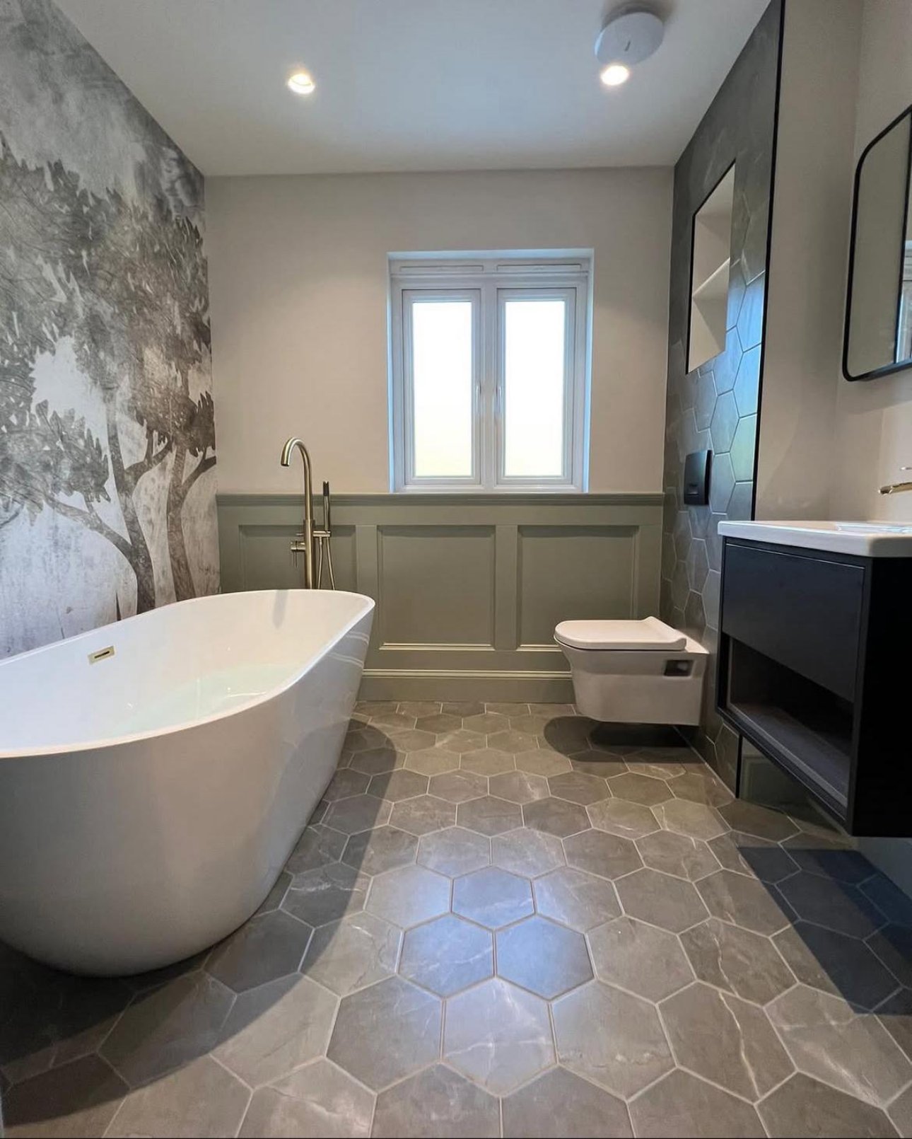 Completed all-in-house bathroom fitting with freestanding bath and hexagon tiled floor in Edinburgh